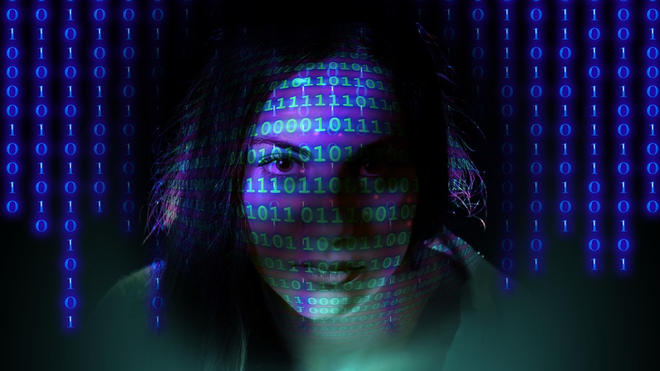 Woman's face with binary code overlaid