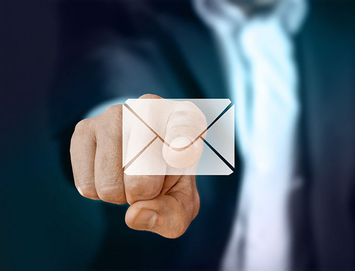 Businessman finger pointing to email icon
